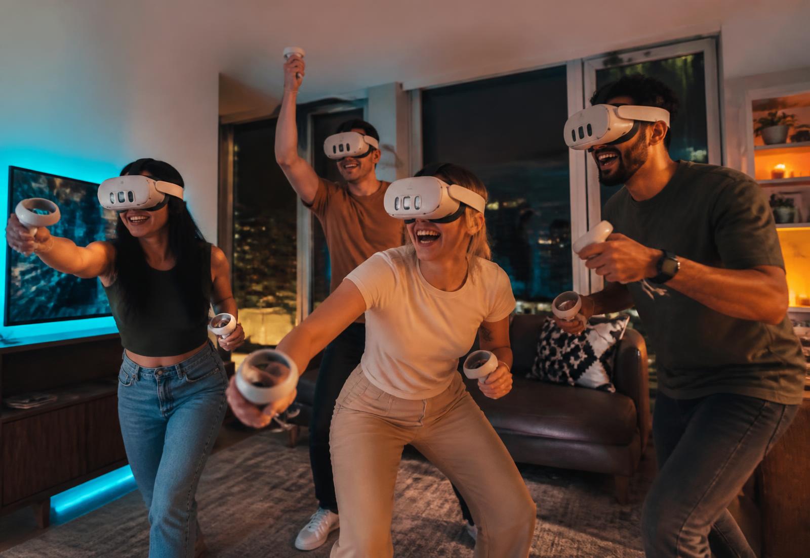Friends playing together in VR headsets at a home party in Winnipeg